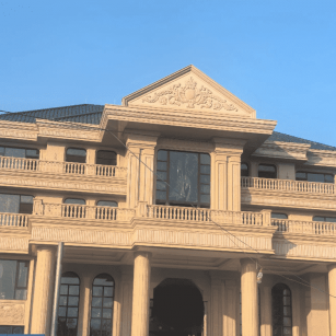 徐州黄金麻别墅外墙干挂石材效果示例